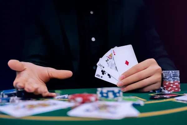 SPINARA Mobile Casino — Play anytime, anywhere A player using their smartphone during a festive local event, representing SPINARA’s fully mobile-friendly casino.