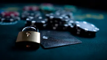 A laptop glowing with a bright login prompt in a minimalistic setup, symbolizing the protected access system at SPINARA.